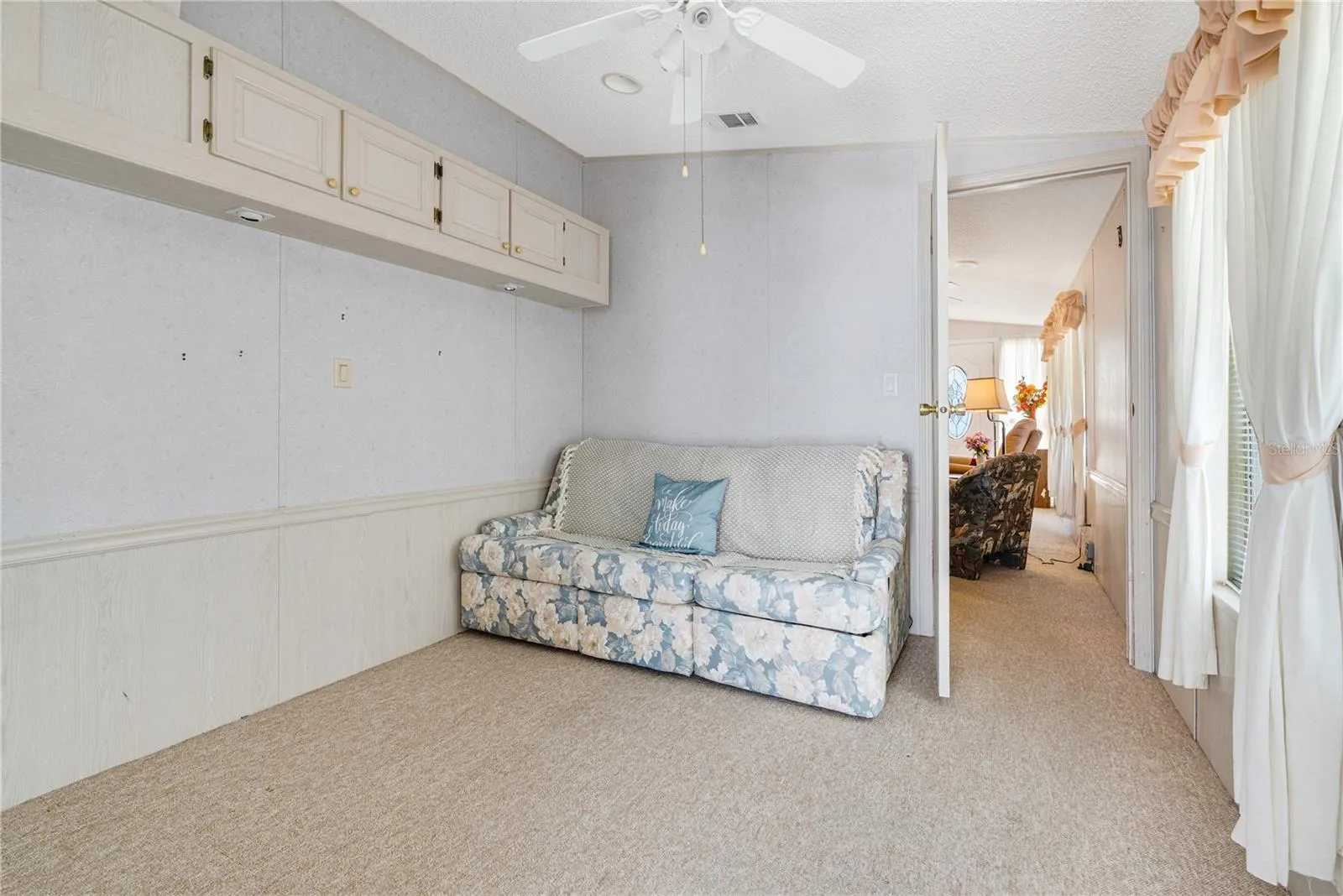 This reception/bonus room benefits from a closet and could be used as a second bedroom