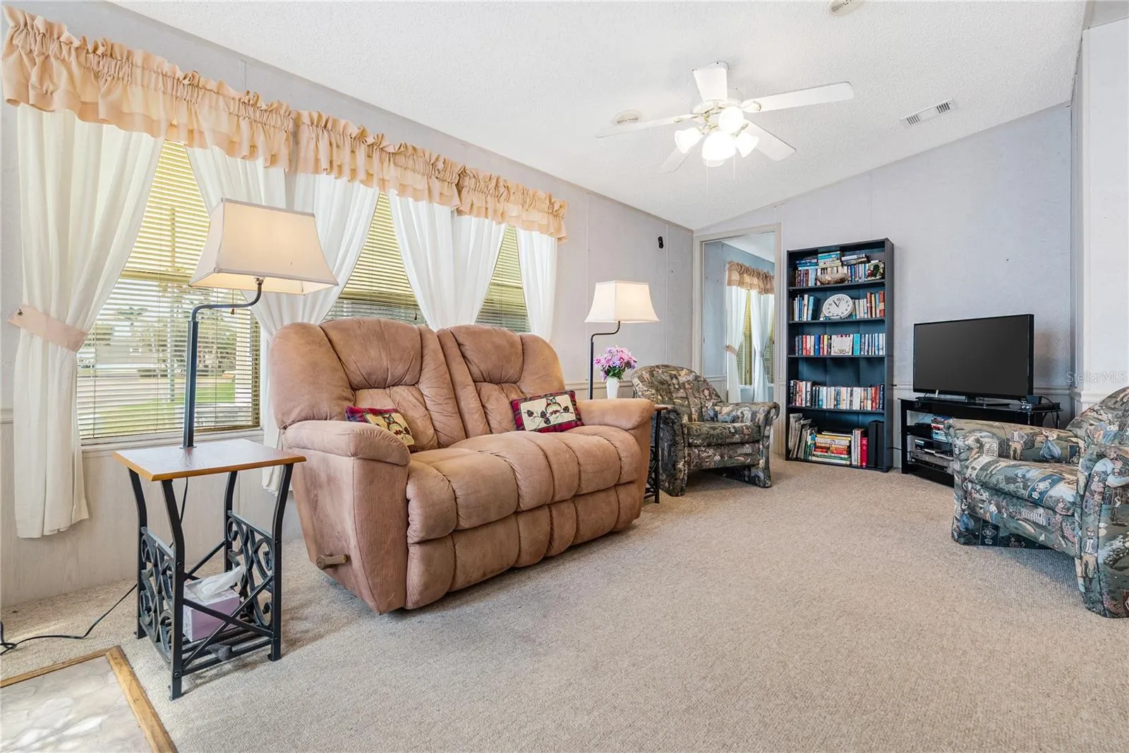 Natural light pour through the windows of the living area