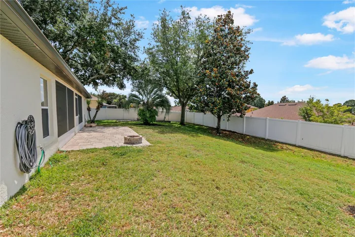 Spacious, fenced yard, paver patio with fire pit