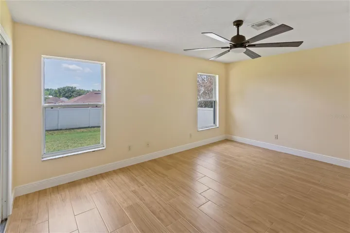 Primary bedroom with slider access to patio