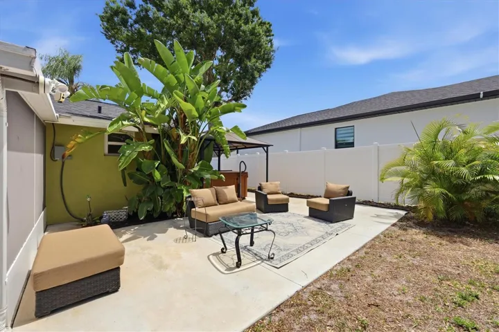 Side patio with hot tub