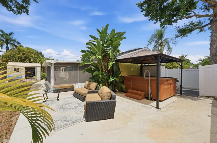 Side patio with hot tub