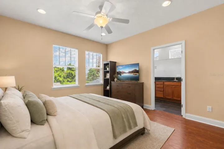 Serene primary suite featuring a spacious layout, warm natural light, and a calming, neutral aesthetic.