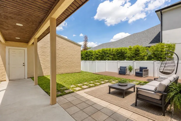 Expansive outdoor space featuring multiple areas for lounging and enjoying Florida living.