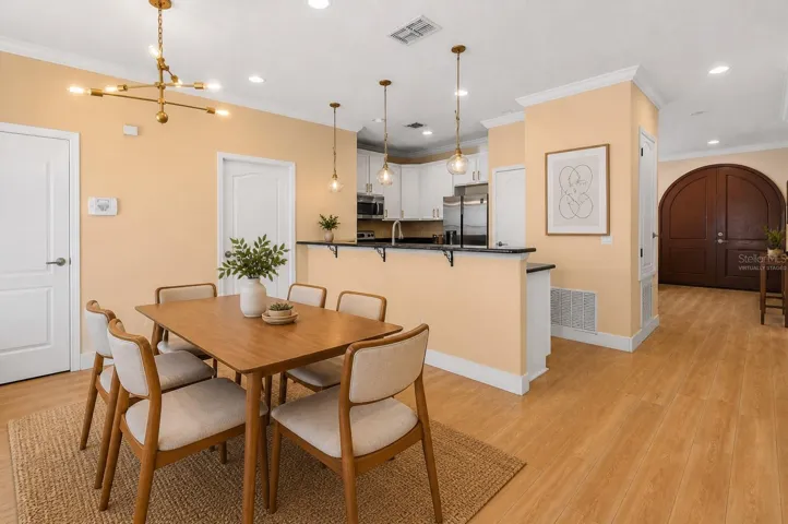 Virtually staged to show the future buyer different layouts that can be used for this room