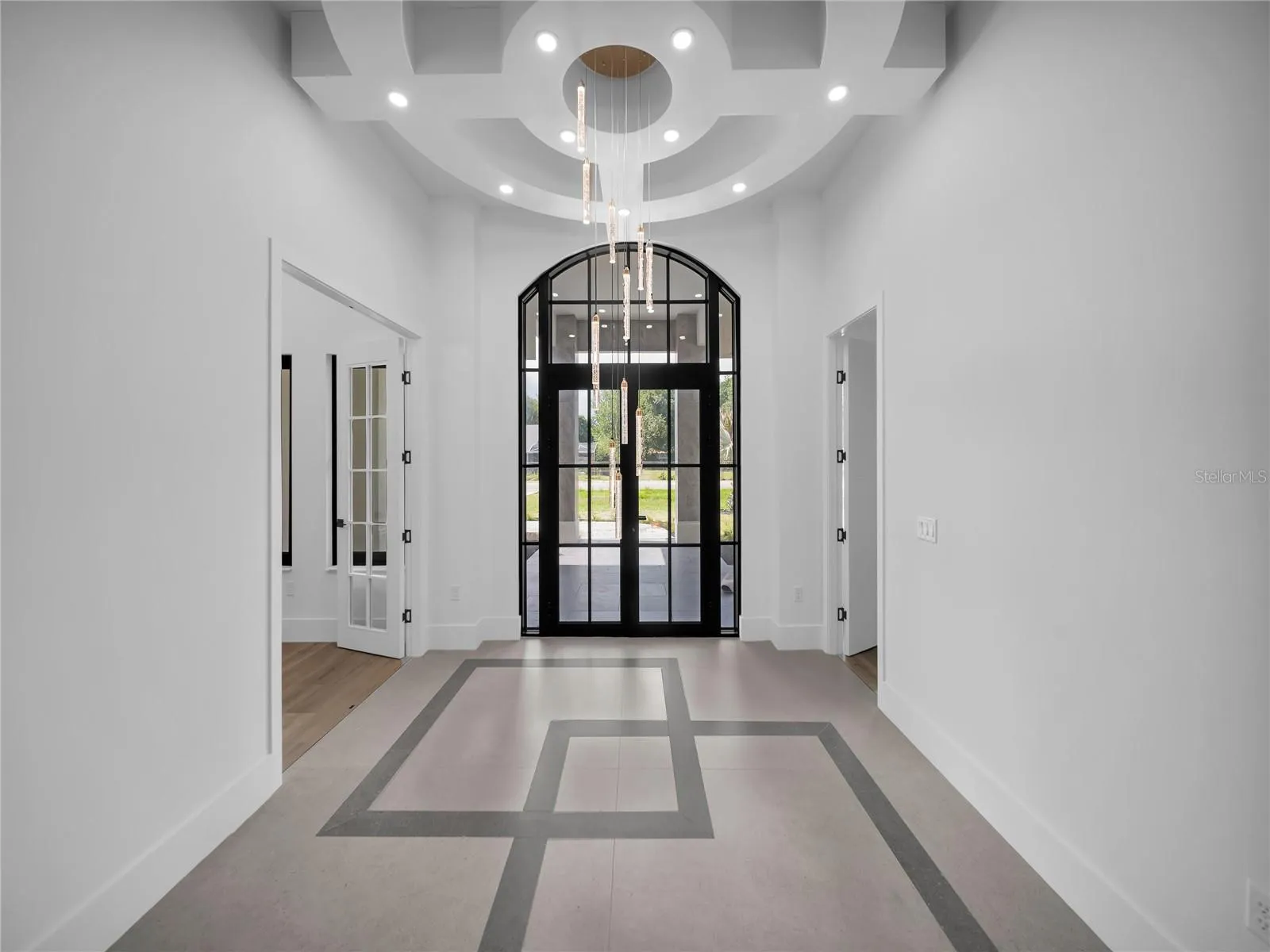 Dramatic foyer with custom ceiling detail