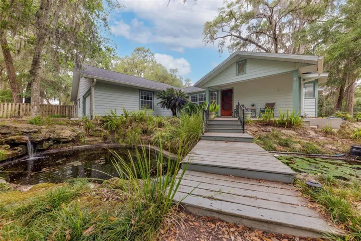Exterior view of home with Koi Pond