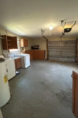 1 Car Garage with a washer and dryer