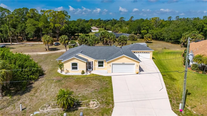 2002 built home on oversized lot and features TWO garages