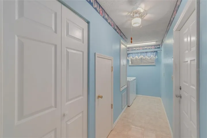 Large Indoor Laundry Room with Storage