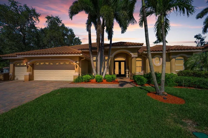 Large Home with Lush Tropical Landscape &amp; Extra Garage Space