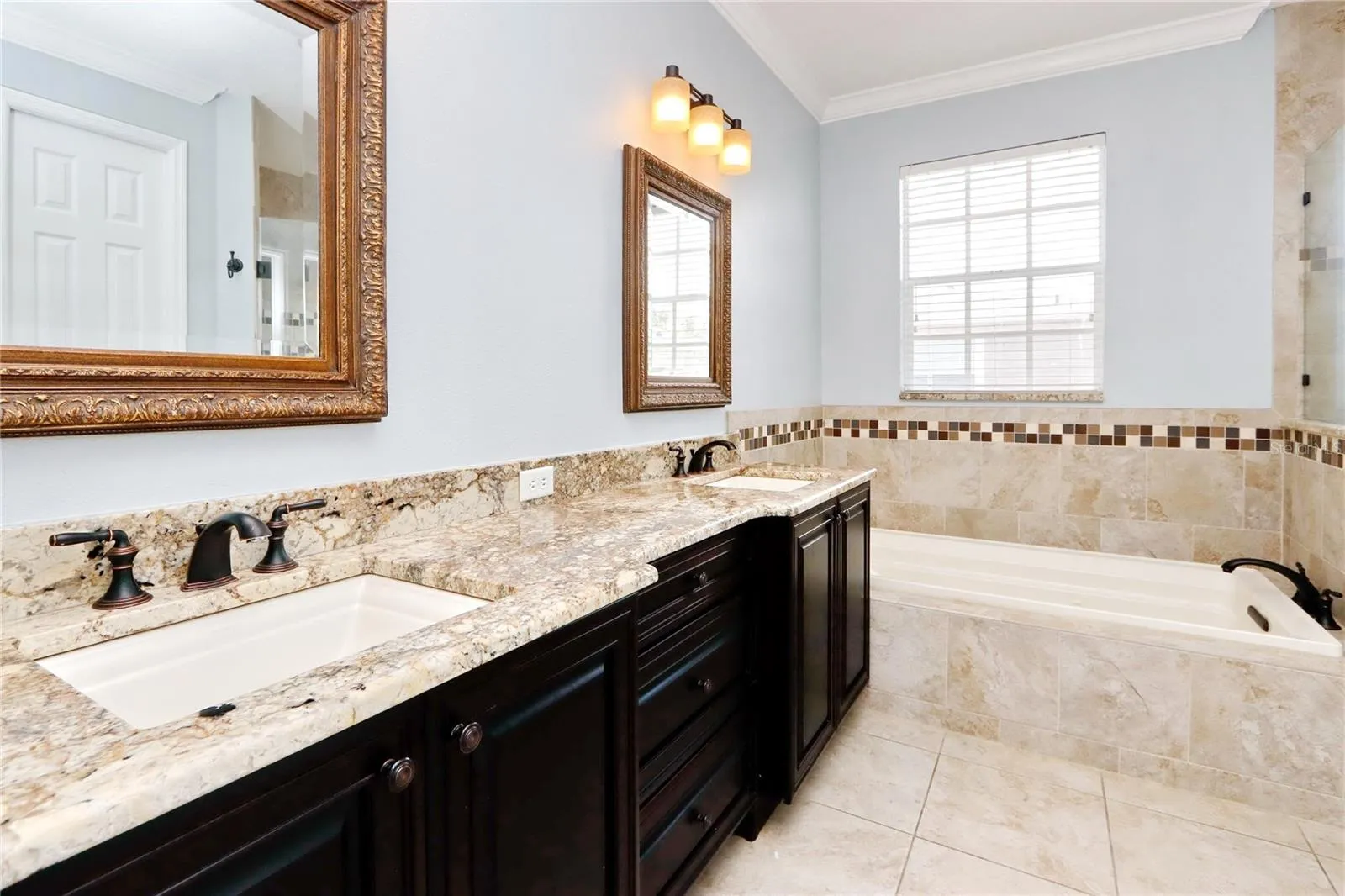 PRIMARY BEDROOM EN-SUIRE WITH JETTED TUB, DUAL SINK VANITY, LARGE WALK IN SHOWER, AND WATER CLOSET