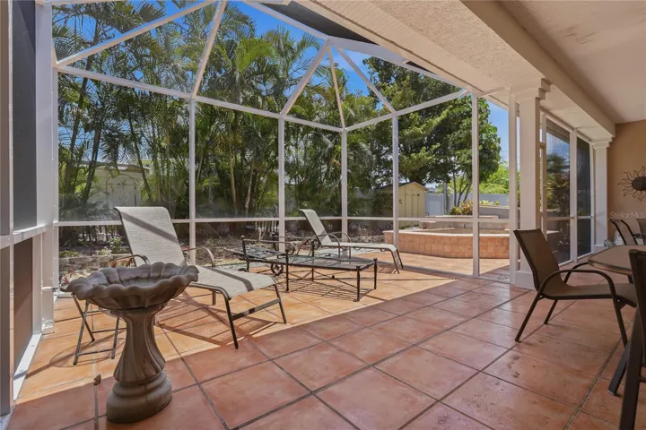 RELAX AND ENJOY THE SUNSHINE.  VINYL FENCING ENCIRCLES THE BEAUTIFUL MANICURED LANDSCAPING FEATURING MANY MATURE PALMS.