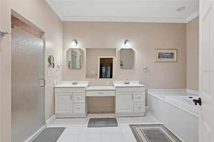 DUAL SINKS A WALK IN SHOWER AND A SOAKING TUB.