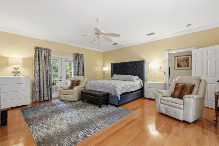 THE MASTER BEDROOM IS VERY SPACIOUS AND ENTENDS TO THE SCREENED PORCH THRU FRENCH DOORS