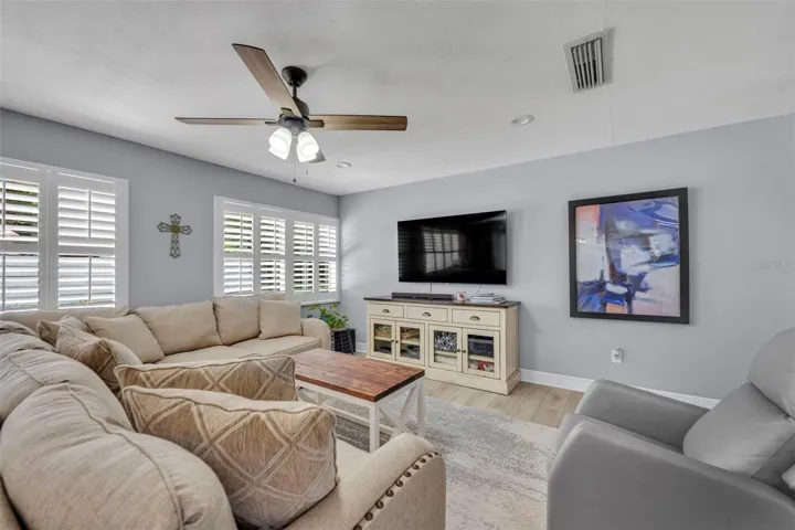Plantation shutters featured on living room windows