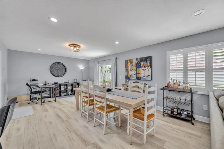Living/dining combo with sliding glass door access to the backyard
