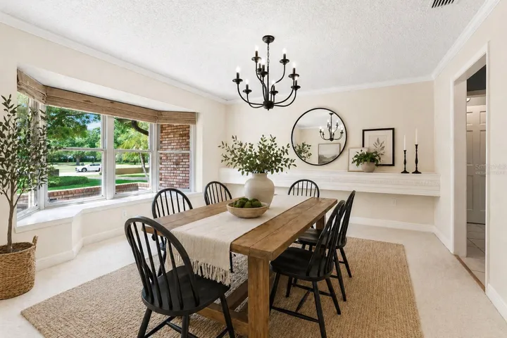 Virtually Staged Dining Room with walls changed to virtual cream color to show what could be