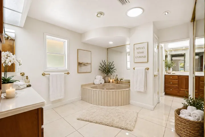 Virtually staged Primary Bath with walls virtually changed to cream color