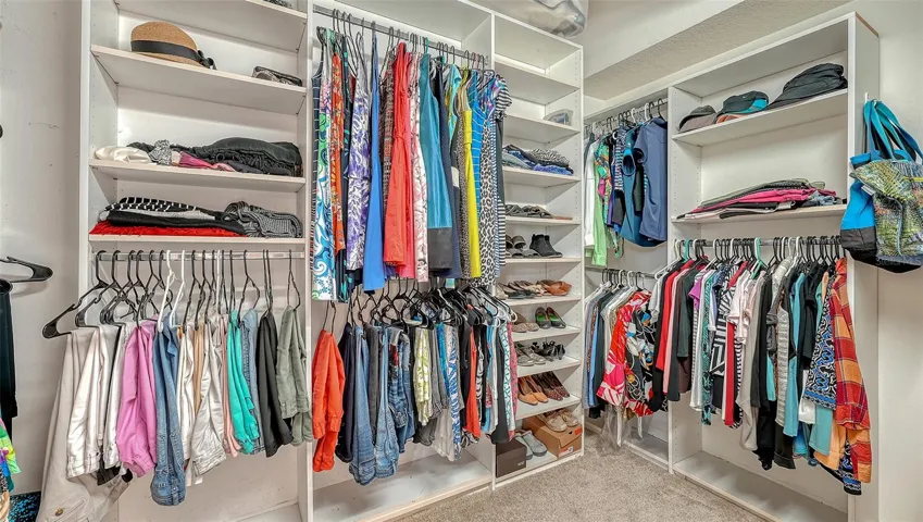 Huge walk in closet with built in shelves