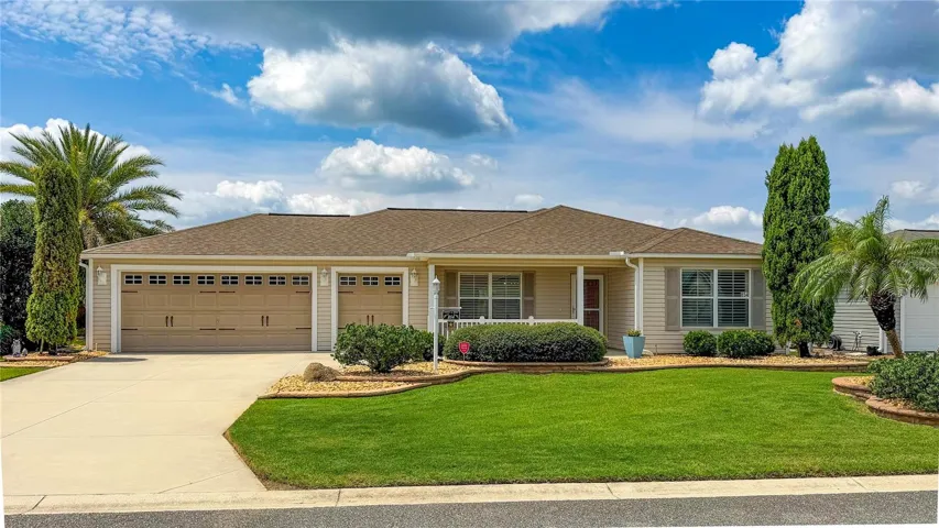 Front elevation with 2-car and golf cart garage in Village of Sanibel