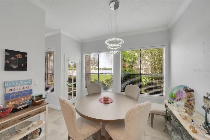Dining room and glassed lanai door overlooking Egypt Lake