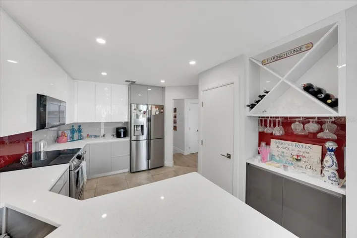Coffee/liquor nook with lower cabinetry and bottle racks