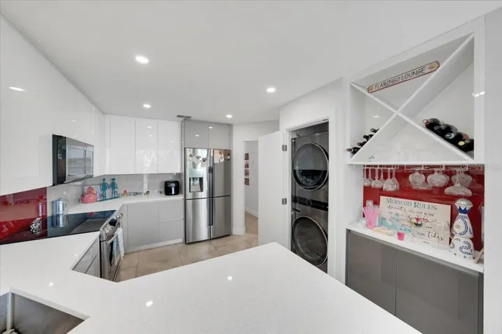 Kitchen area fully renovated with pantry, high grade SS appliances, quarts countertops, wood cabinetry with built in features!