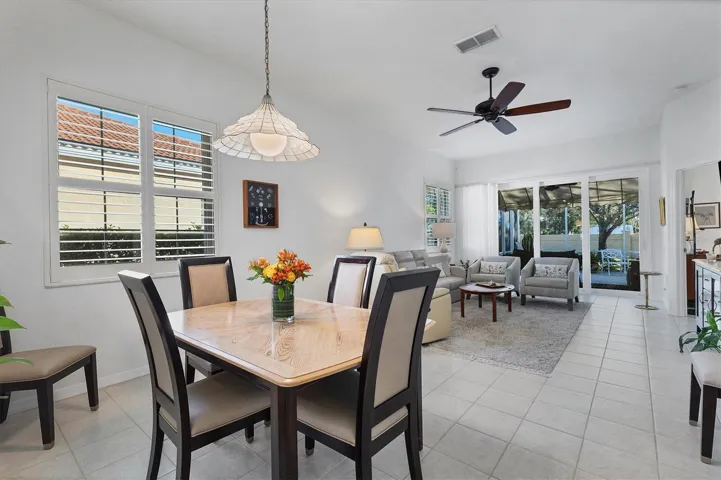 Note how the space flows from the dining room into the living          area out to the lanai and yard