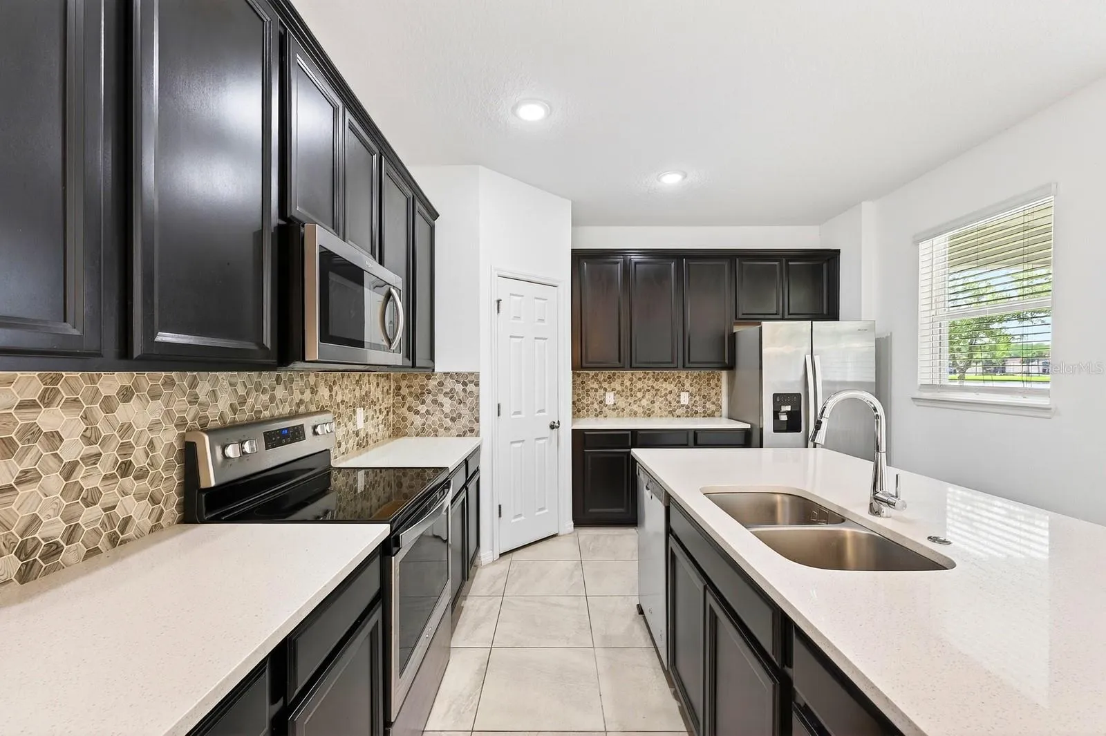Stainless steel appliances, a stylish backsplash and sleek countertops are a home chef's dream.