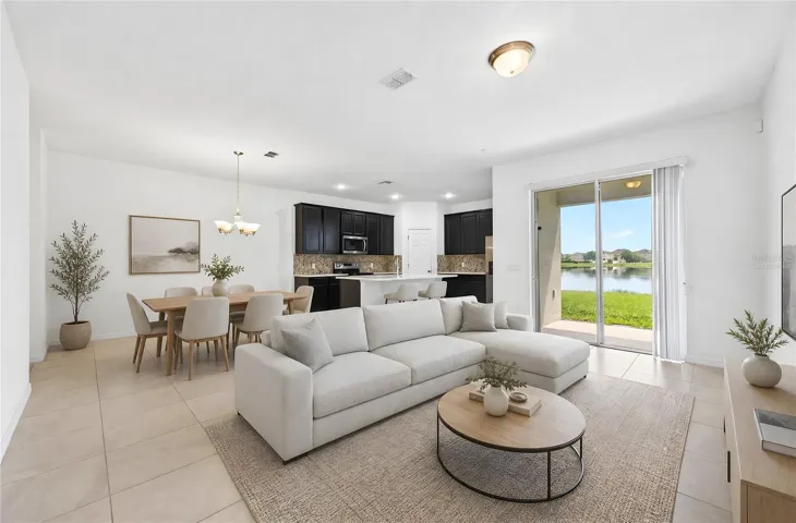 Light, bright open concept living and dining with tranquil pond views! Virtually Staged.