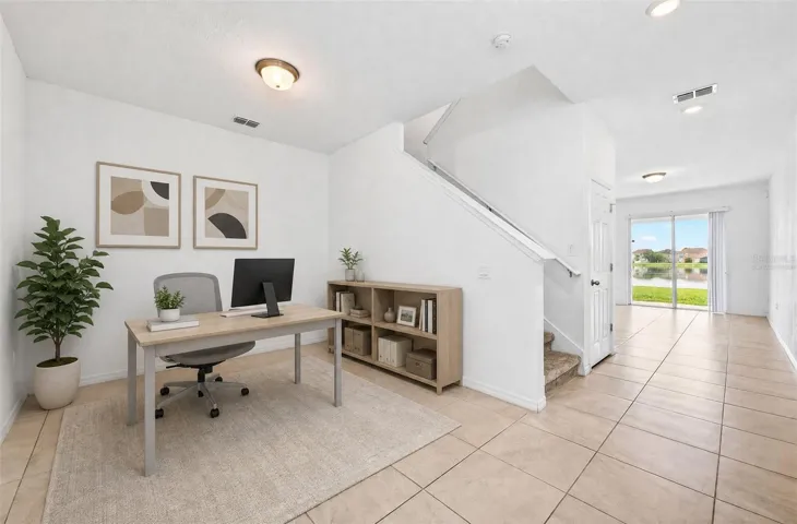 Versatile flex space at the front of the home makes a great home office, play space or additional living area!  Virtually Staged.