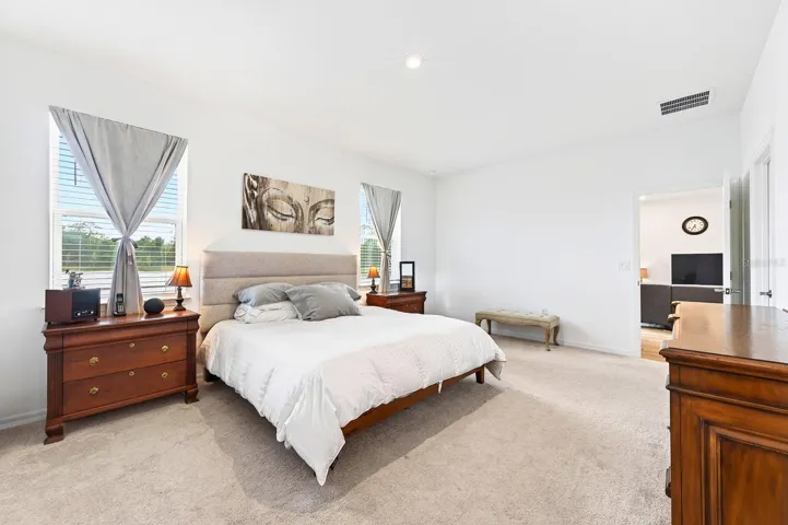 Light, bright primary suite becomes your tranquil retreat.