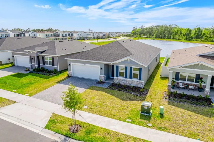 Skip the wait and step into brand new construction – this 2025 BUILT home in the Brack Ranch community of St. Cloud is ready right now, set on a premium POND VIEW LOT with peaceful WOODED, water and green space views behind you!