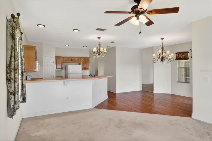 From the family room, the view carries back through the dinette and kitchen, with light moving easily across the space.