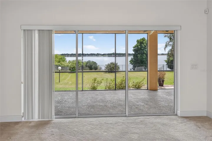 Whether you’re inside or out on the lanai, the view stays with you—across the yard and out to the lake.