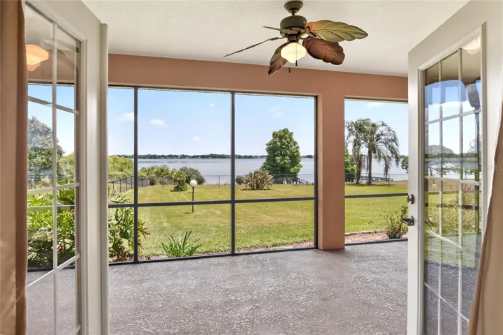 From the primary bedroom, step straight onto the lanai and out to the lake—facing east, it’s where the day begins with the sunrise.