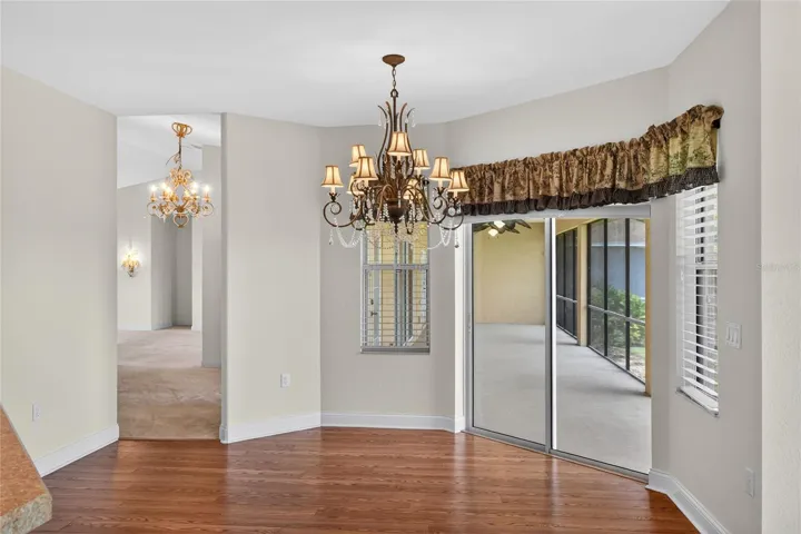 And again, from the dinette, family room, and kitchen, another path opens to the lanai, keeping the light and lake always within reach.