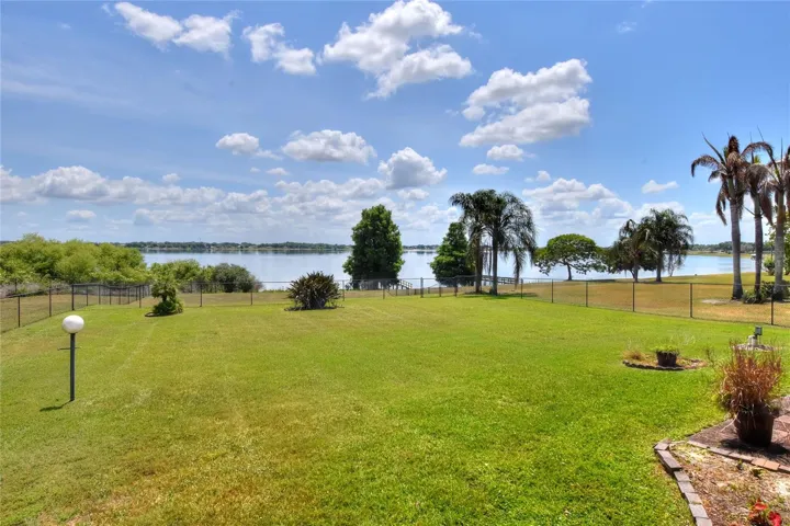 Out here, it all slows down—the yard, the light, and the lake settling in around you.