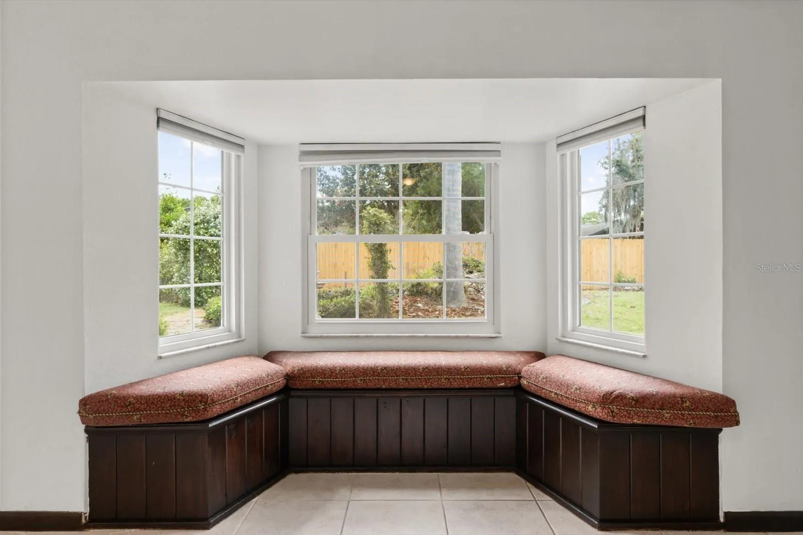 Cozy reading nook in bay window in family room