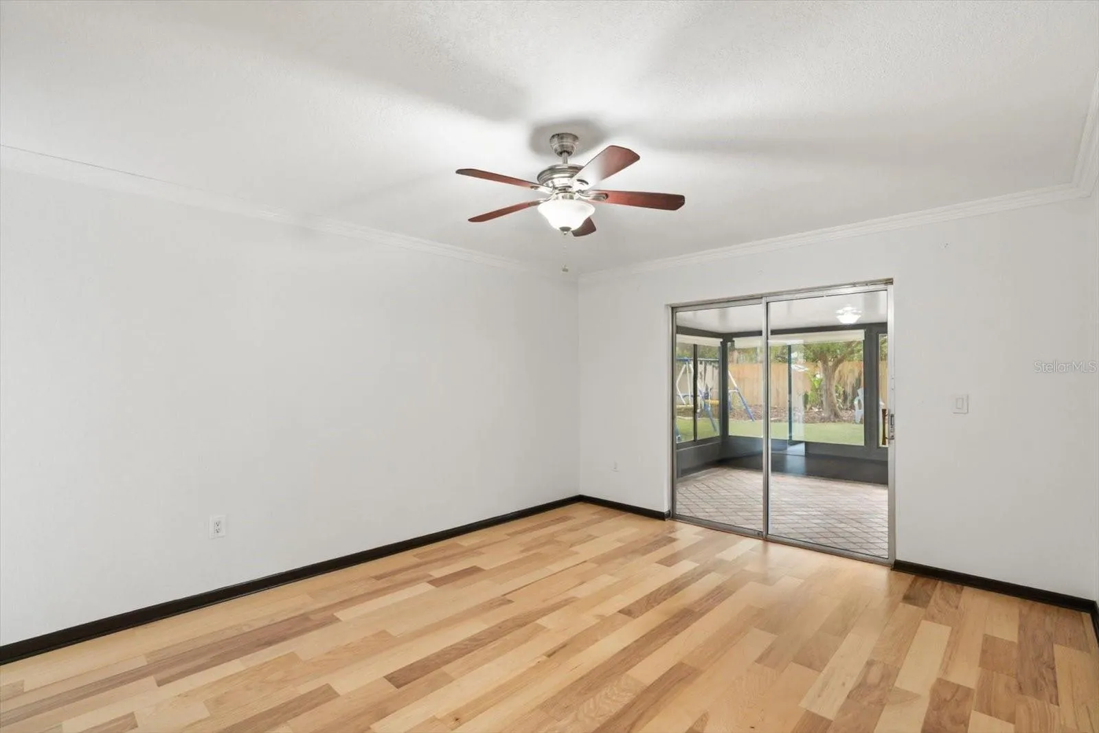Primary bedroom opens up to enclosed lanai