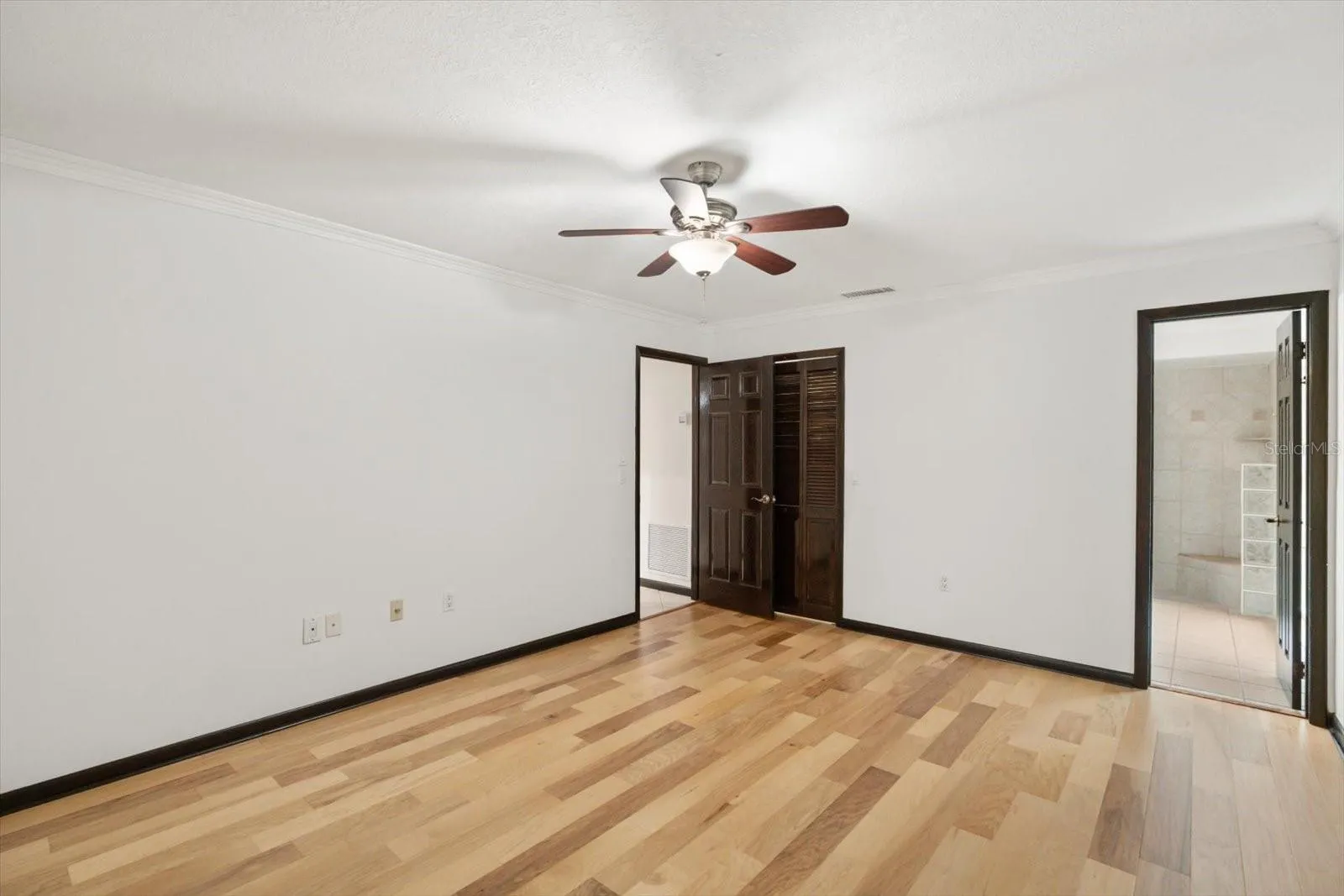 New engineered hardwood floor in primary bedroom