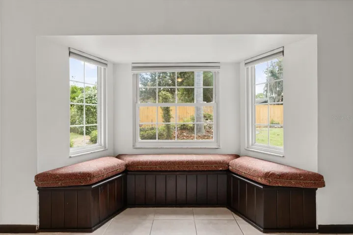 Cozy reading nook in bay window in family room