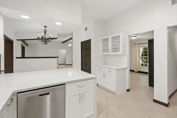 Breakfast bar with waterfall quartz countertop