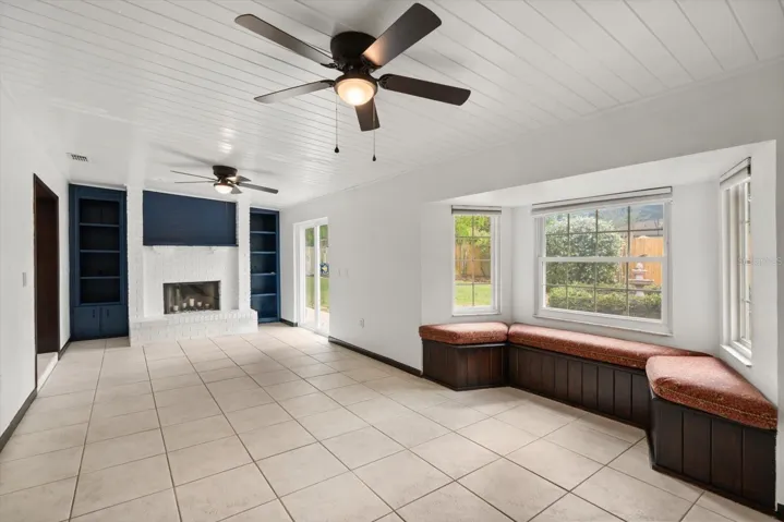 Family room has built in shelves around 2nd fireplace