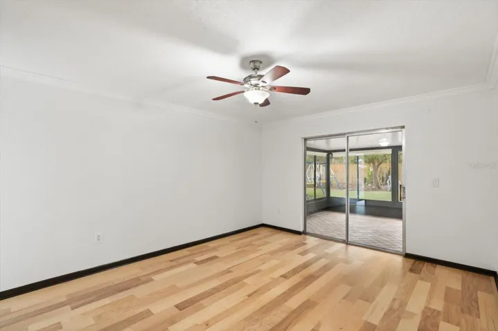 Primary bedroom opens up to enclosed lanai