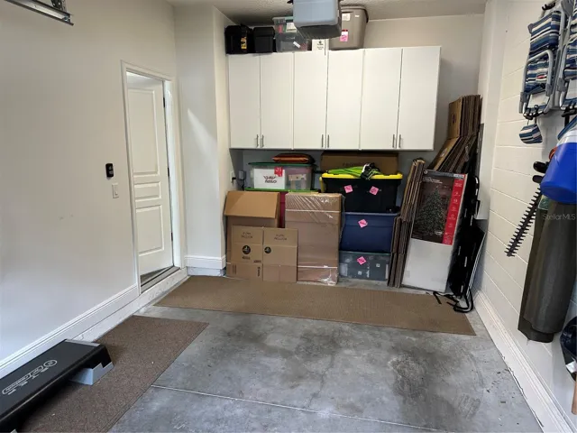 Cabinet storage in Garage, Direct access door to front hall