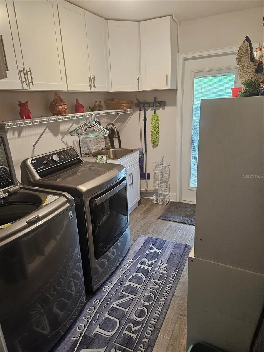 Laundry, washer/drier, and new wall cabinets