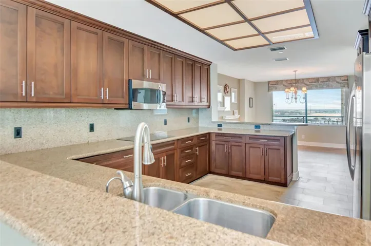 Beautiful cabinets with granite countertops and GE profile upscale appliances
