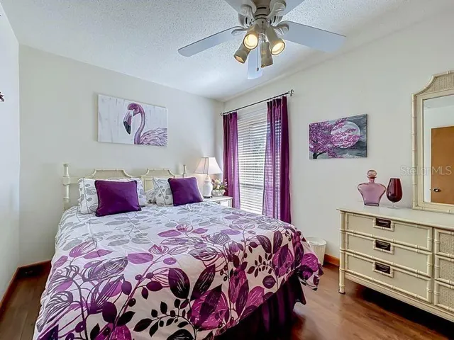 Second Bedroom: Large window for lighting- Engineered wood flooring